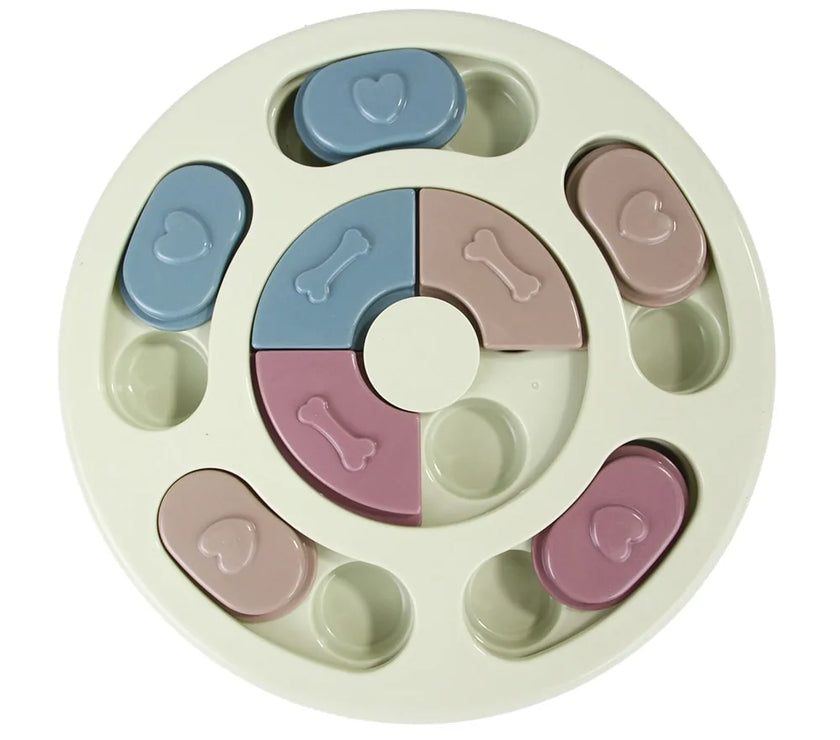 a pastel-colored round-shaped puzzle toy - uncover kibble stored beneath the sliders.