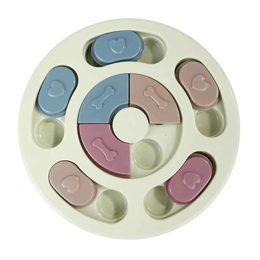 a pastel-colored round-shaped puzzle toy - uncover kibble stored beneath the sliders.