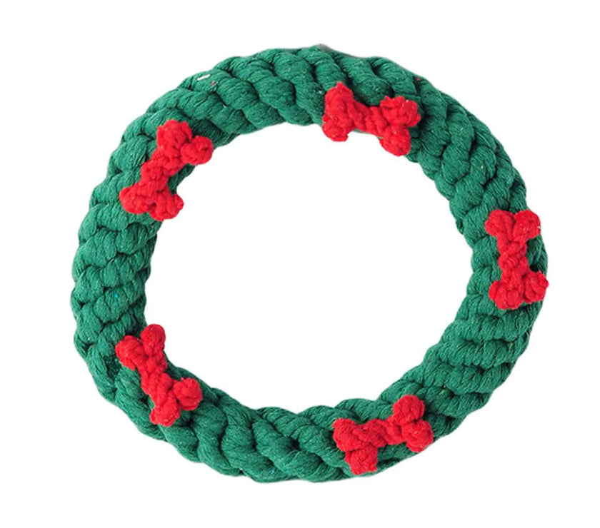 Green rope ring with red bone-shaped loops on a white background