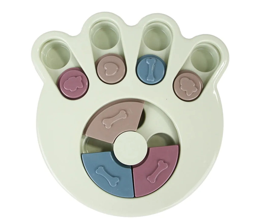 a pastel-colored paw-shaped puzzle toy - uncover kibble stored beneath the sliders.