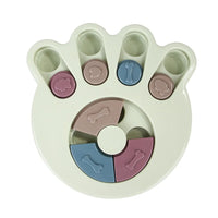 a pastel-colored paw-shaped puzzle toy - uncover kibble stored beneath the sliders.