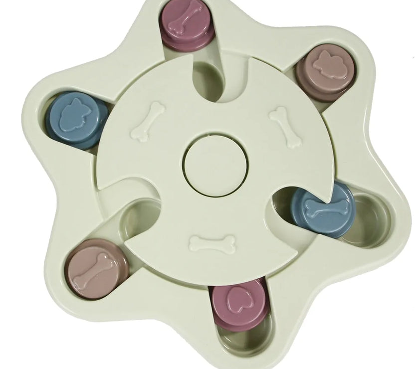a pastel-colored  puzzle toy - uncover kibble stored beneath the sliders.
