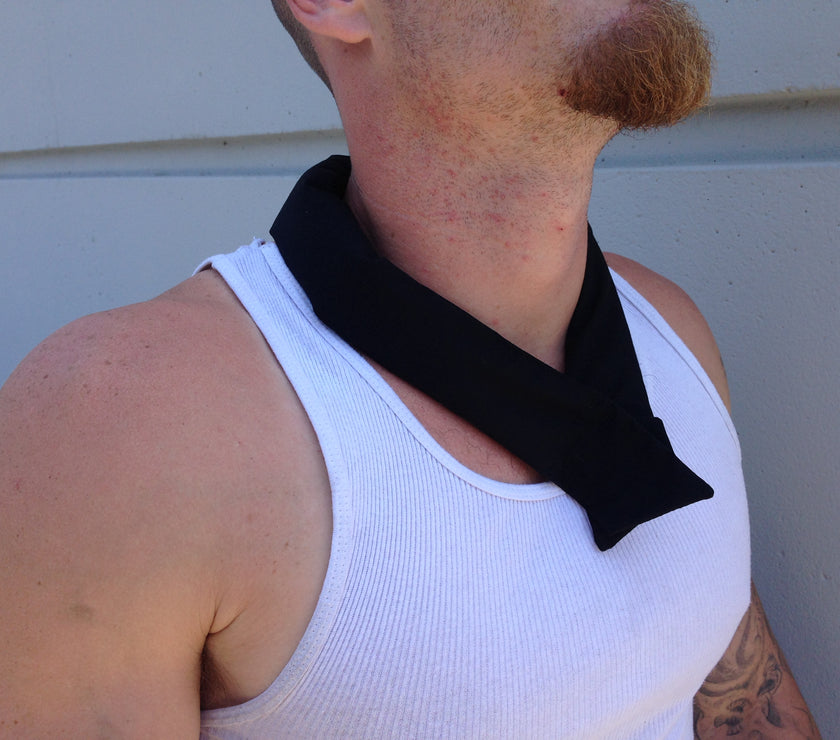 A man wearing a black cooling neck wrap tied around her neck