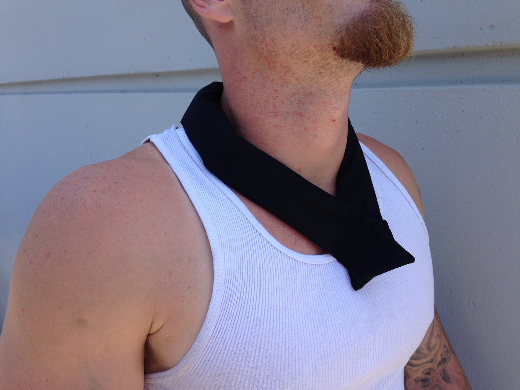 A man wearing a black cooling neck wrap tied around her neck