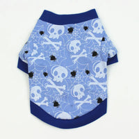 Dog shirt with skull and crossbones pattern on a blue background