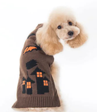 Dog wearing a brown sweater with Halloween-themed design on a white background