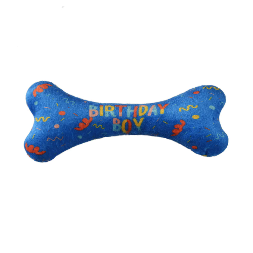 Blue bone-shaped toy with 'Birthday Boy' text on a white background