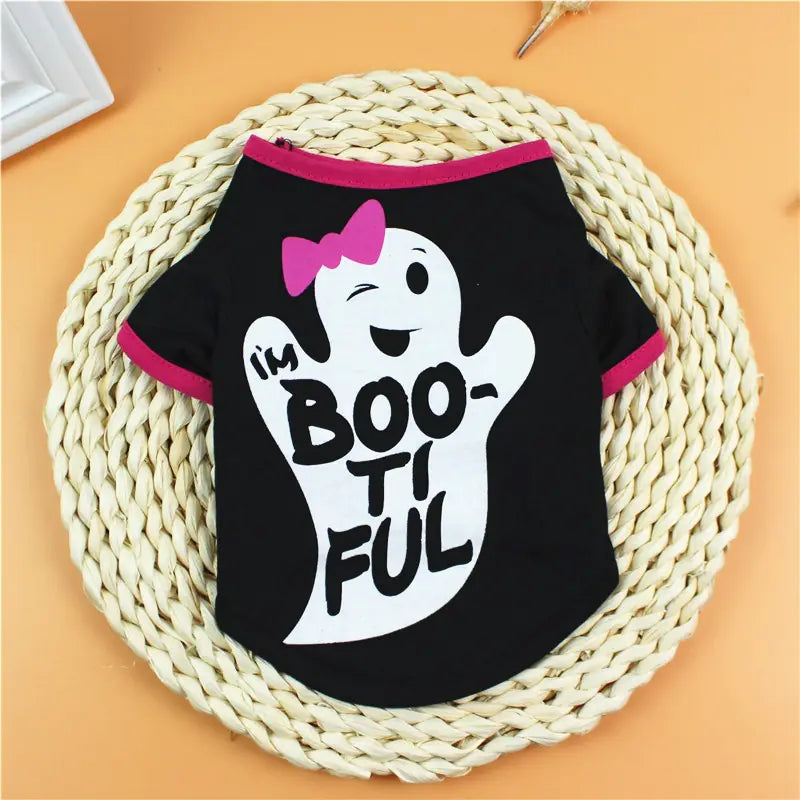 Black pet shirt with ghost design and 'I'm BOO-ti FUL' text on a woven mat.