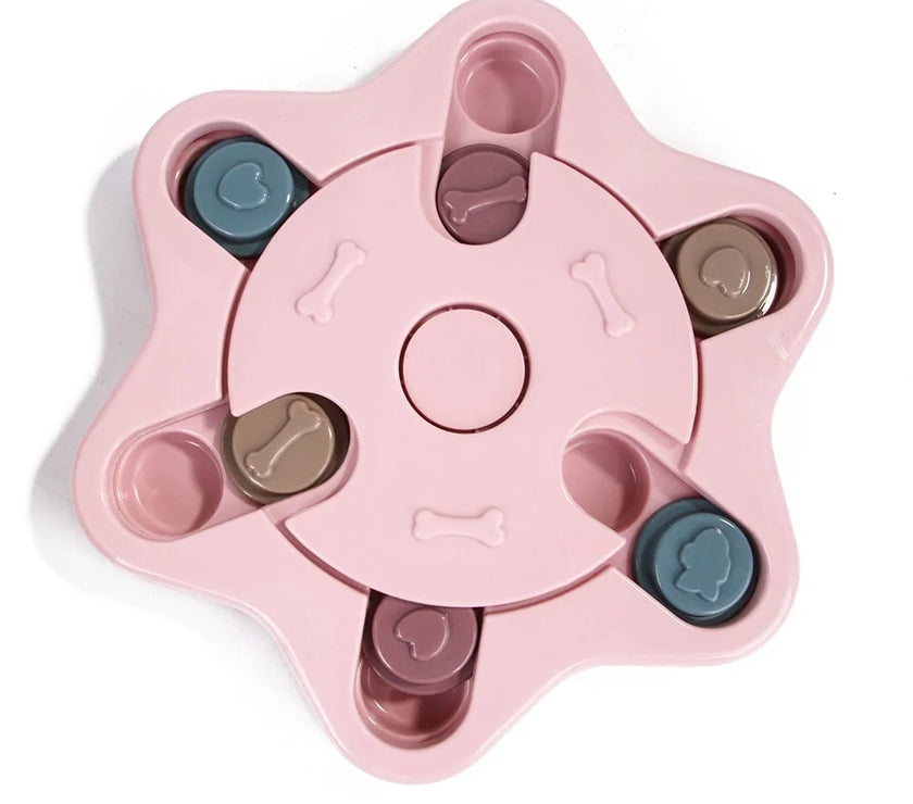 a pastel-colored  puzzle toy - uncover kibble stored beneath the sliders.