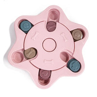 a pastel-colored  puzzle toy - uncover kibble stored beneath the sliders.