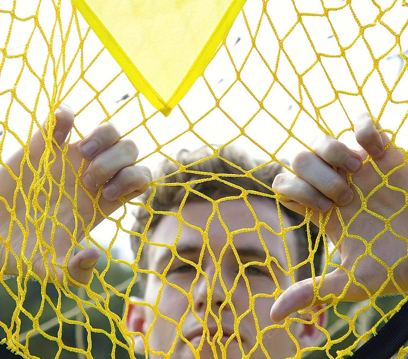 Person behind a yellow net with a blurred background