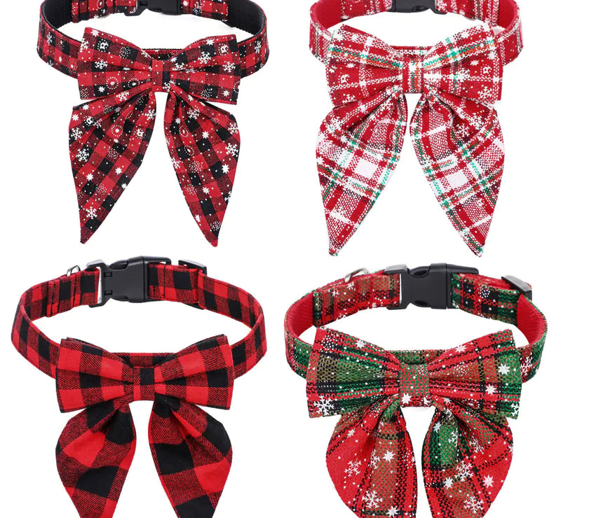 Four plaid dog collars with bows on a white background