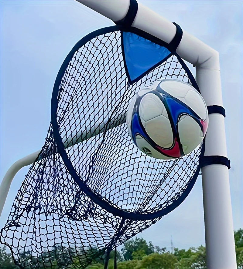 Soccer ball in a goal net against a clear blue sky