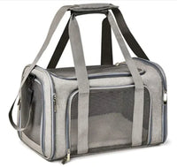 Gray pet carrier with mesh side on a white background