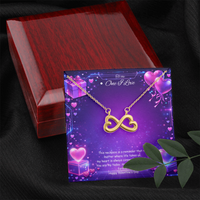 Gold infinity heart necklace displayed in a gift box on a purple Valentine-themed background symbolizing endless love.