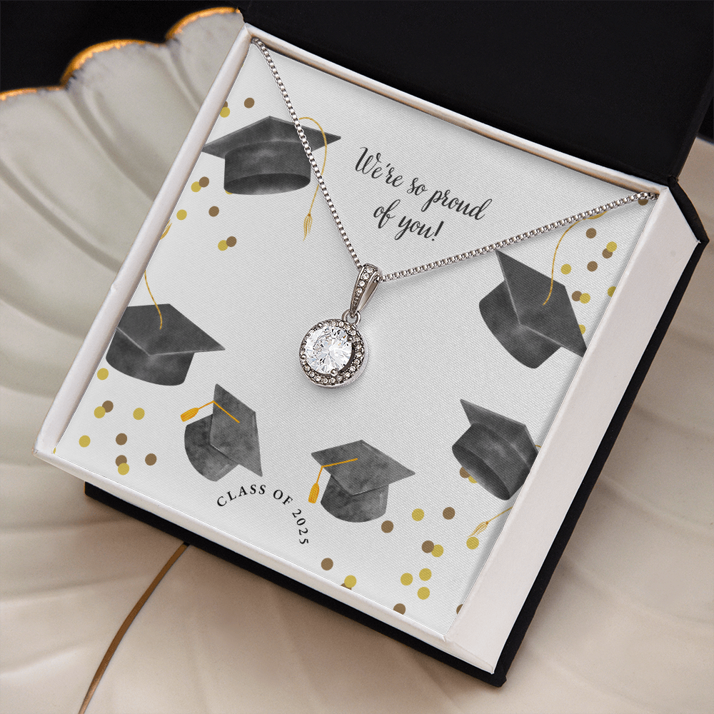 Open gift box displaying a sparkling silver Eternal Hope necklace with a round pendant, set against a graduation-themed message card that reads "We're so proud of you!" with graduation caps, gold confetti, and "Class of 2025" text.