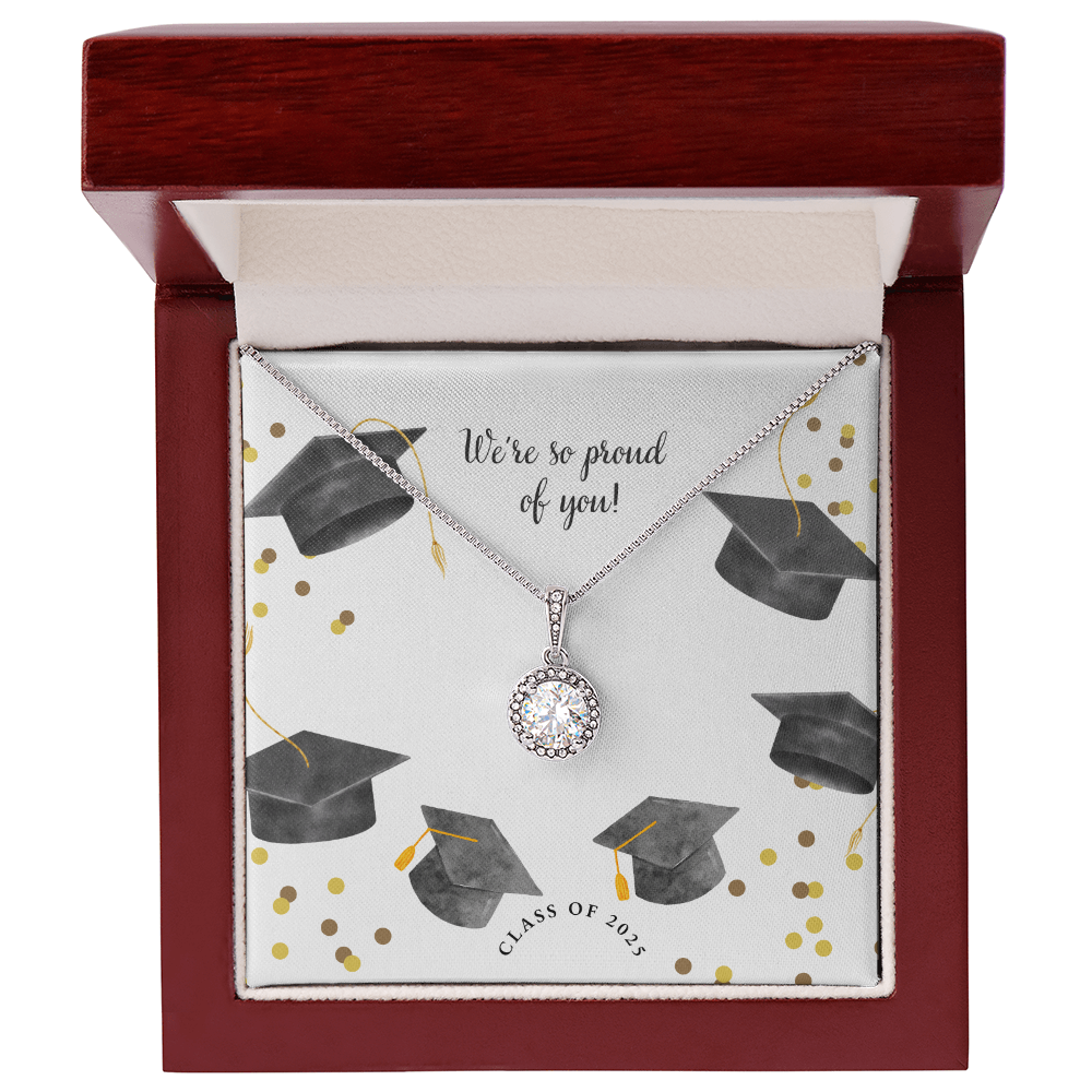 Open gift box displaying a sparkling silver Eternal Hope necklace with a round pendant, set against a graduation-themed message card that reads "We're so proud of you!" with graduation caps, gold confetti, and "Class of 2025" text.