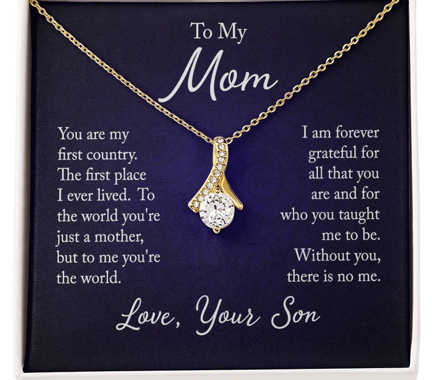 Alluring Beauty necklace features a petite ribbon shaped pendant with message card To Mom