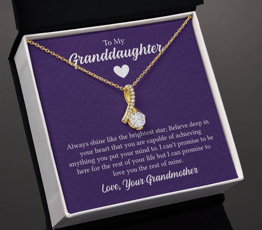Alluring Beauty necklace features a petite ribbon shaped pendant with message card To My Granddaughter