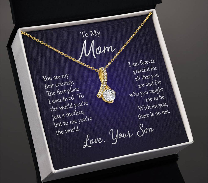 Alluring Beauty necklace features a petite ribbon shaped pendant with message card To Mom