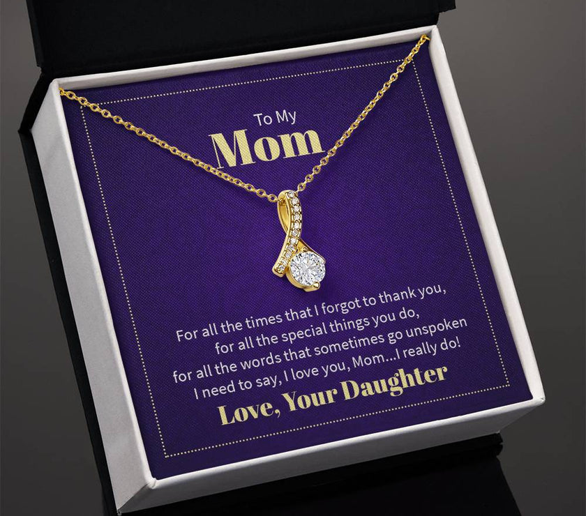 Alluring Beauty necklace features a petite ribbon shaped pendant with message card To Mom  18k Yellow Gold finish