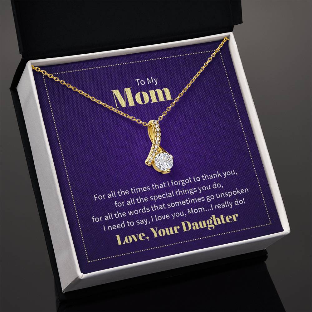 Alluring Beauty necklace features a petite ribbon shaped pendant with message card To Mom  18k Yellow Gold finish