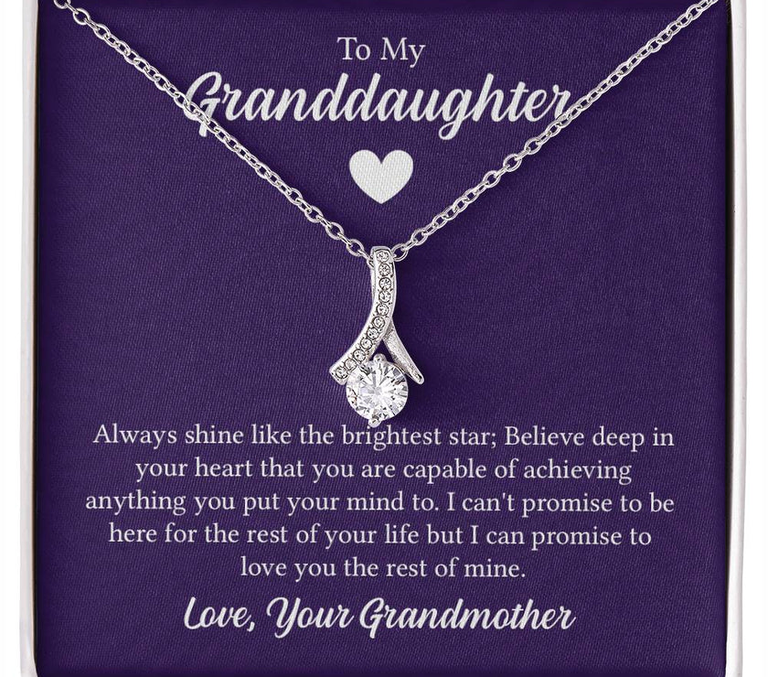 Alluring Beauty necklace features a petite ribbon shaped pendant with message card To My Granddaughter