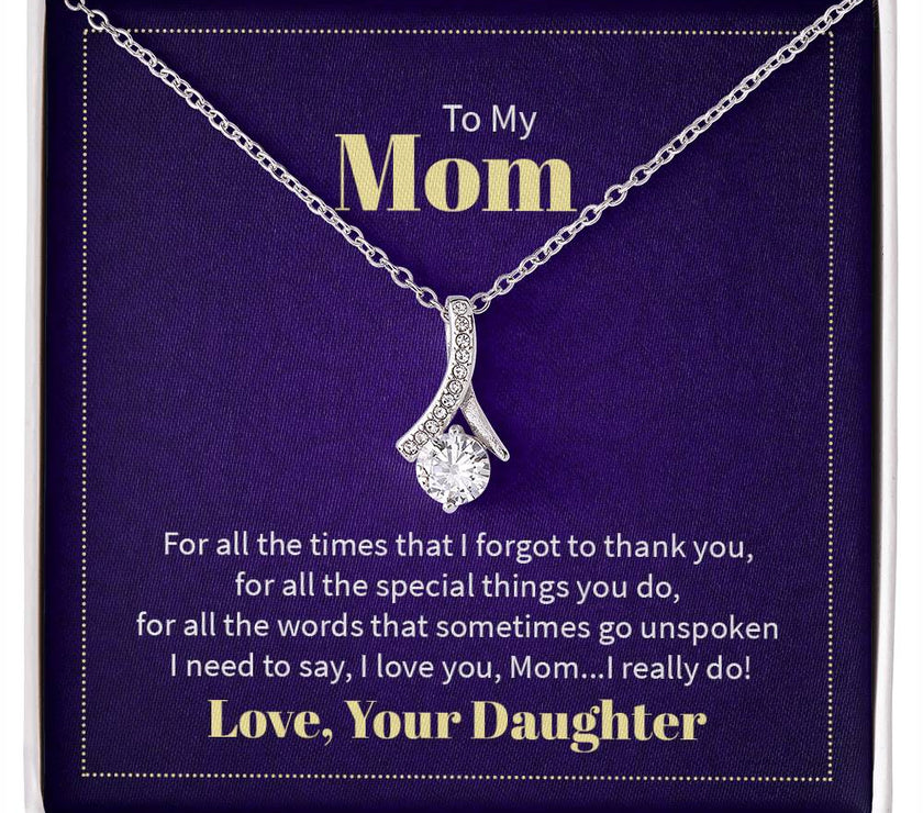 Alluring Beauty necklace features a petite ribbon shaped pendant with message card To Mom