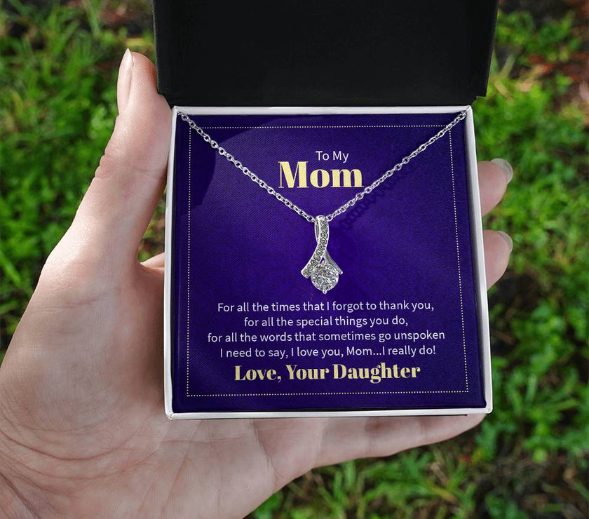 Alluring Beauty necklace features a petite ribbon shaped pendant with message card To Mom  White Gold Finish