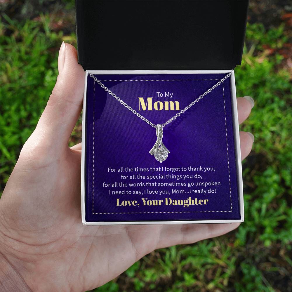 Alluring Beauty necklace features a petite ribbon shaped pendant with message card To Mom  White Gold Finish