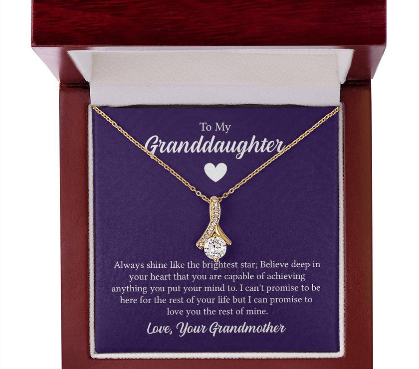 Alluring Beauty necklace features a petite ribbon shaped pendant with message card To My Granddaughter