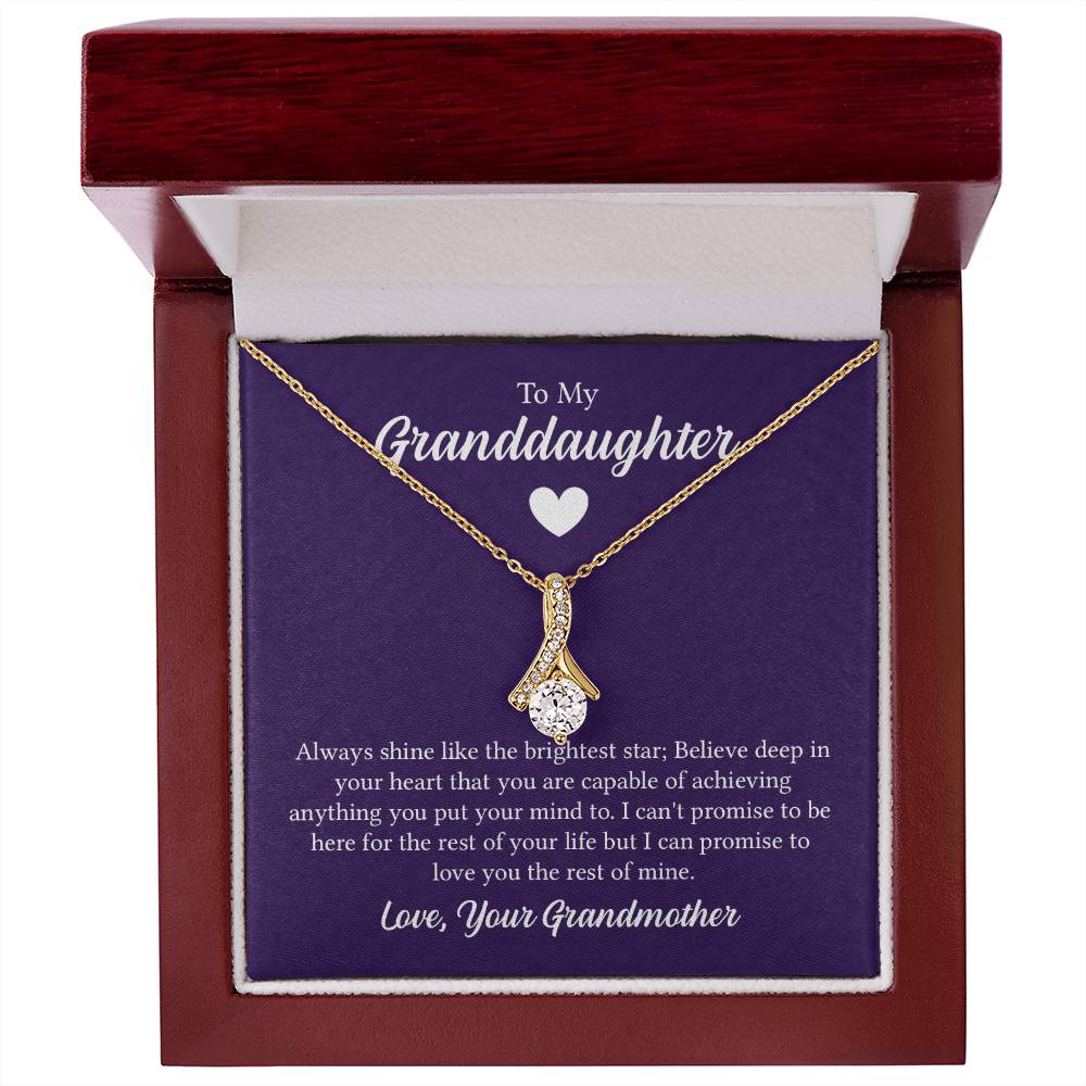 Alluring Beauty necklace features a petite ribbon shaped pendant with message card To My Granddaughter