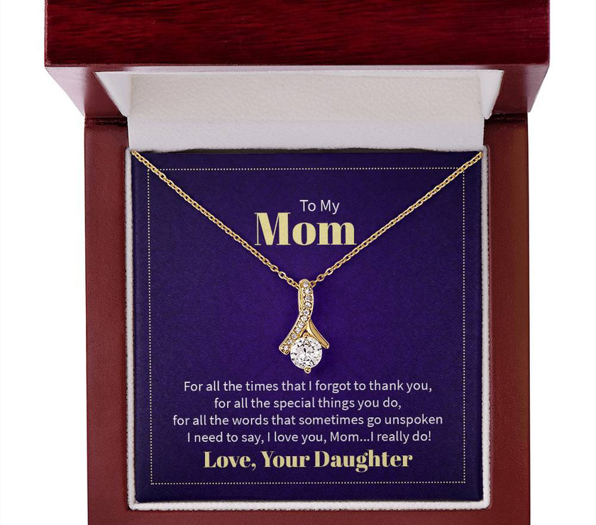 Alluring Beauty necklace features a petite ribbon shaped pendant with message card To Mom  18k yellow gold finish