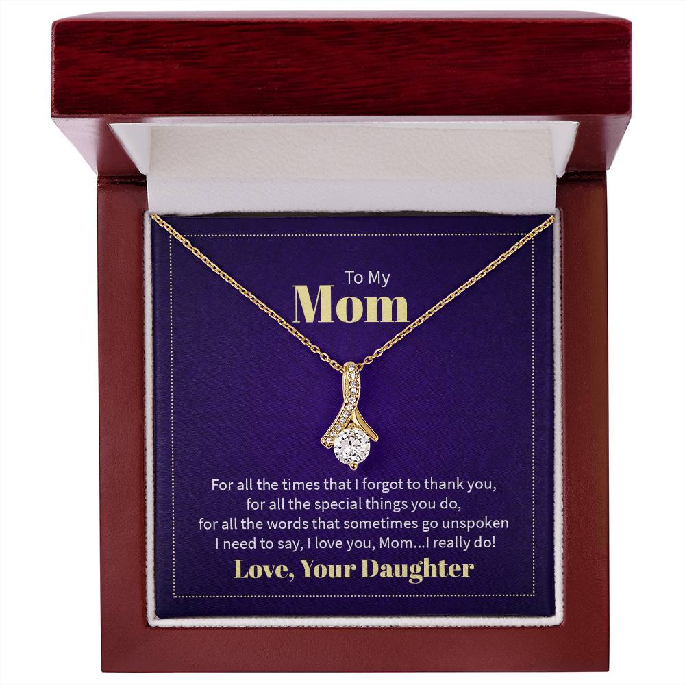 Alluring Beauty necklace features a petite ribbon shaped pendant with message card To Mom  18k yellow gold finish