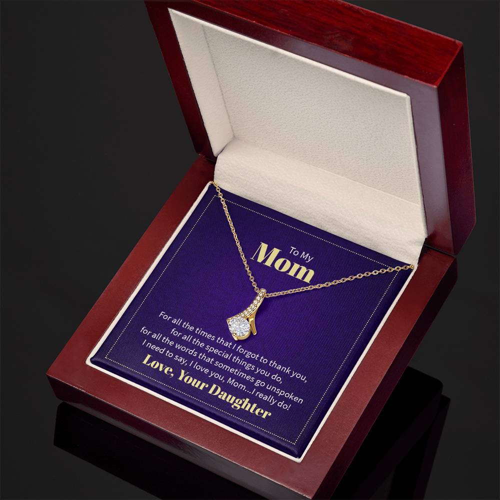 Alluring Beauty necklace features a petite ribbon shaped pendant with message card To Mom  18k yellow gold finish