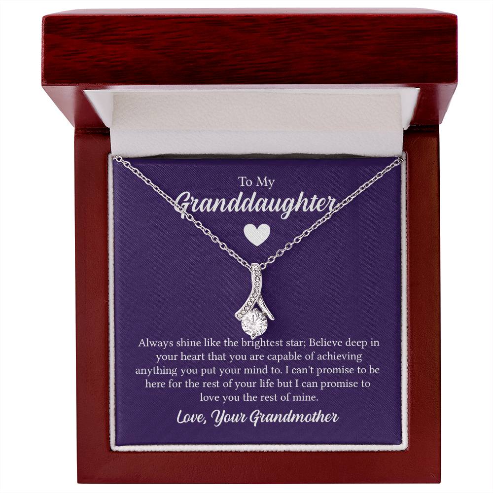 Alluring Beauty necklace features a petite ribbon shaped pendant with message card To My Granddaughter