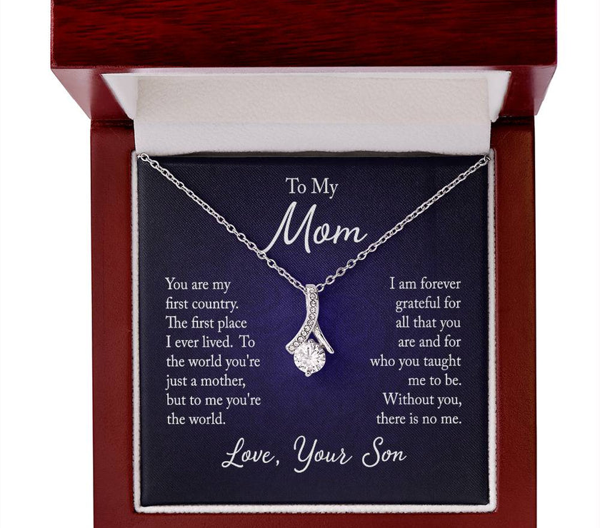 Alluring Beauty necklace features a petite ribbon shaped pendant with message card To Mom