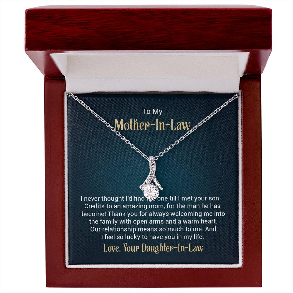 Alluring Beauty necklace features a petite ribbon shaped pendant with message card To My  Mother-In-Law