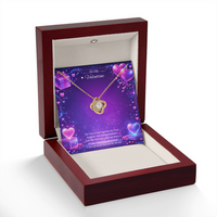 Gold love knot necklace with a sparkling center stone displayed on a purple Valentine’s Day background with glowing hearts, symbolizing eternal love and romantic connection.