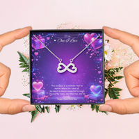 Silver infinity heart necklace displayed in a gift box on a purple Valentine-themed background symbolizing endless love.