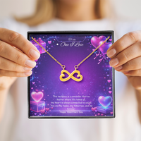 Gold infinity heart necklace displayed in a gift box on a purple Valentine-themed background symbolizing endless love.