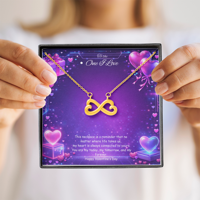Gold infinity heart necklace displayed in a gift box on a purple Valentine-themed background symbolizing endless love.