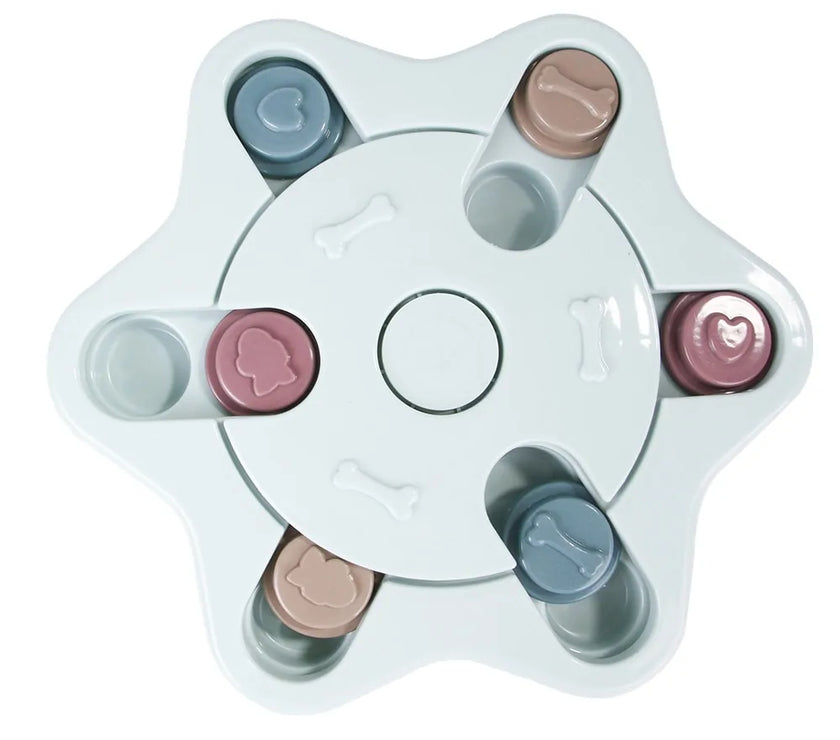a pastel-colored  puzzle toy - uncover kibble stored beneath the sliders.