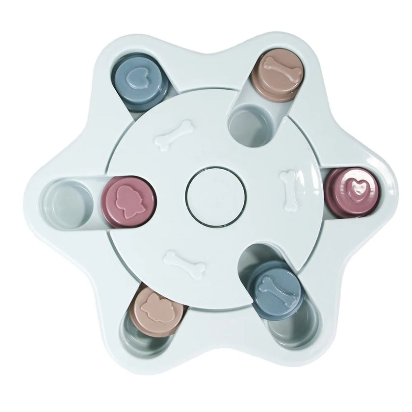 a pastel-colored  puzzle toy - uncover kibble stored beneath the sliders.