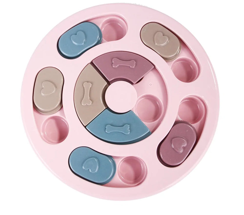 a pastel-colored round-shaped puzzle toy - uncover kibble stored beneath the sliders.