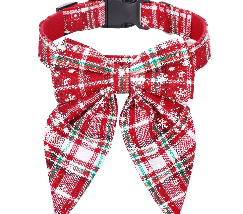 Red plaid dog collar with a matching bow on a white background