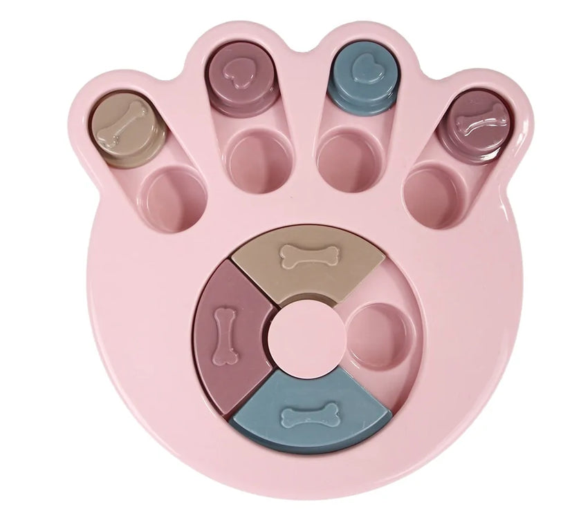 a pastel-colored paw-shaped puzzle toy - uncover kibble stored beneath the sliders.