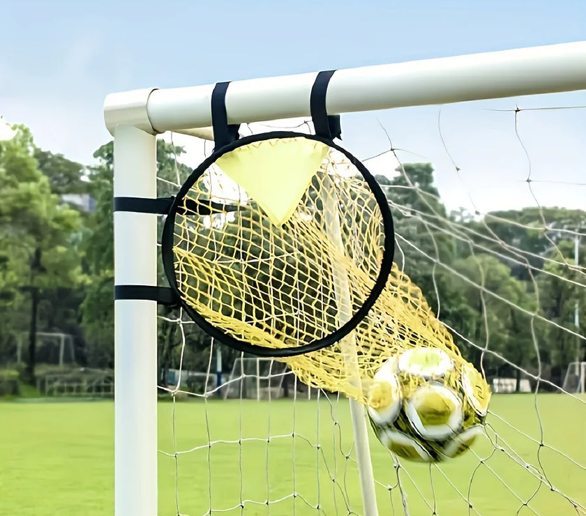 Yellow soccer ball inside a goal net with a clear sky and trees in the background