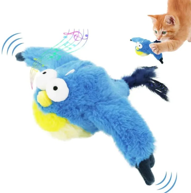A playful orange kitten interacts with a plush blue bird cat toy that features exaggerated eyes, sound and motion effects, and colorful musical notes to indicate interactive play.