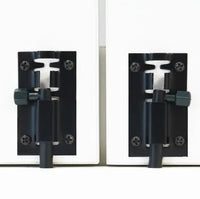 Pair of black metal door hinges on a white background